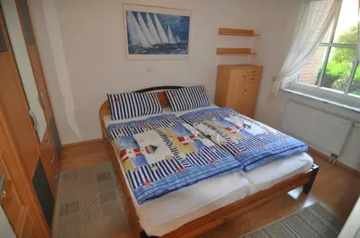 Ein Bett oder Betten in einem Zimmer der Unterkunft FeWo ostseele - Sunny