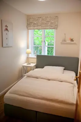 Ein Bett oder Betten in einem Zimmer der Unterkunft Ferienwohnung Stina