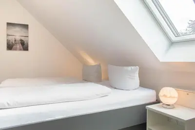 Ein Bett oder Betten in einem Zimmer der Unterkunft Ferienwohnung Windstärke 9