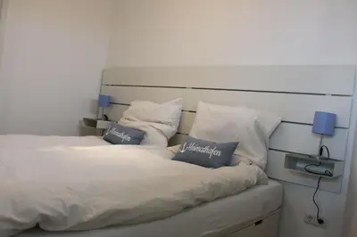 Ein Bett oder Betten in einem Zimmer der Unterkunft StrandChalet Scharbeutz