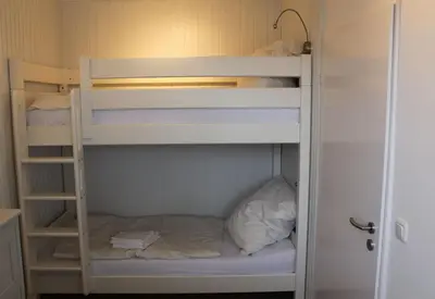 Ein Bett oder Betten in einem Zimmer der Unterkunft StrandChalet Scharbeutz