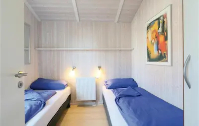 Ein Bett oder Betten in einem Zimmer der Unterkunft Meeresrauschen 2 - Dorf 6