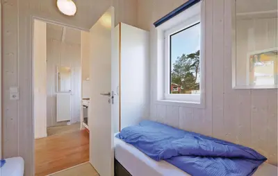 Ein Bett oder Betten in einem Zimmer der Unterkunft Meeresrauschen 2 - Dorf 6