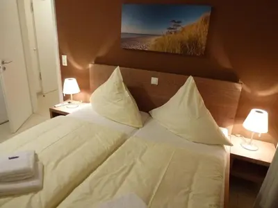 Ein Bett oder Betten in einem Zimmer der Unterkunft Ostsee Lodges zum Wohlfühlen