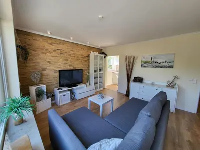 TV/Unterhaltungsangebot in der Unterkunft FeWo Dünengras mit Terrasse und Strandkorb