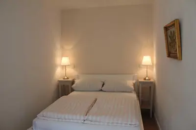 Ein Bett oder Betten in einem Zimmer der Unterkunft Ostseecharme