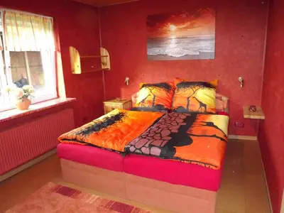 Ein Bett oder Betten in einem Zimmer der Unterkunft Ferienwohnung Ostseenähe