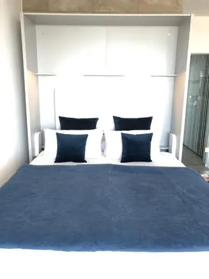 Ein Bett oder Betten in einem Zimmer der Unterkunft Blue City Apartments