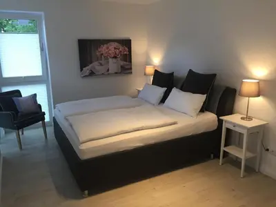 Ein Bett oder Betten in einem Zimmer der Unterkunft Ferienwohnung Küstentraum 2