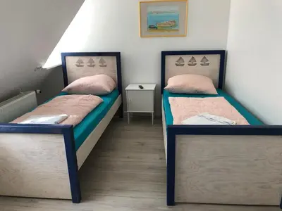 Ein Bett oder Betten in einem Zimmer der Unterkunft Pension Adler
