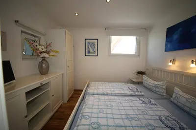 Ein Bett oder Betten in einem Zimmer der Unterkunft Komfort Ferienwohnung Steiger