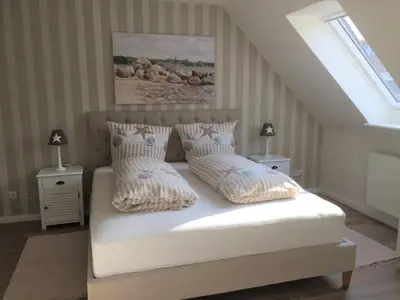Ein Bett oder Betten in einem Zimmer der Unterkunft Ferienhaus Haffmeer
