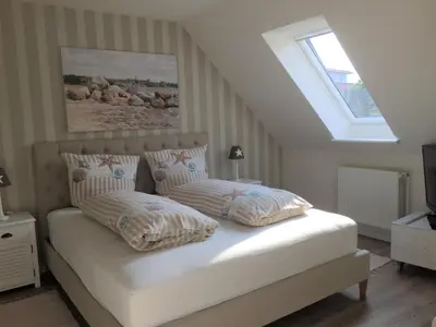 Ein Bett oder Betten in einem Zimmer der Unterkunft Ferienhaus Haffmeer