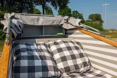 Ein Bett oder Betten in einem Zimmer der Unterkunft Schlafstrandkorb Nr.2