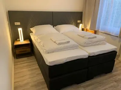 Ein Bett oder Betten in einem Zimmer der Unterkunft Haus 8