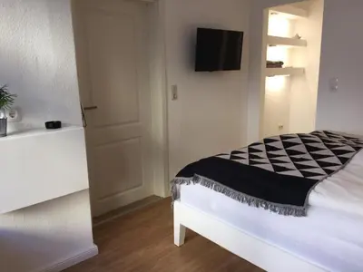 Ein Bett oder Betten in einem Zimmer der Unterkunft zentral gelegenes Ferienzimmer Möllner Seestrasse