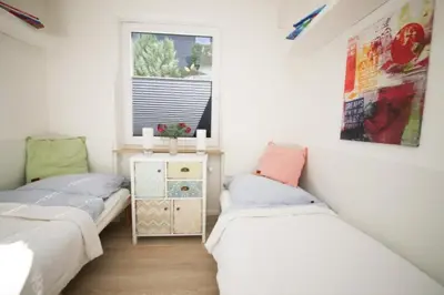 Ein Bett oder Betten in einem Zimmer der Unterkunft Ferienwohnung Meergarten