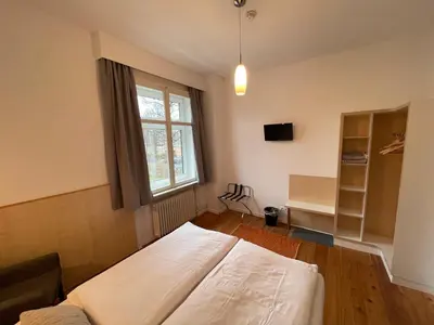 Ein Bett oder Betten in einem Zimmer der Unterkunft ApartHotel Stadtpark