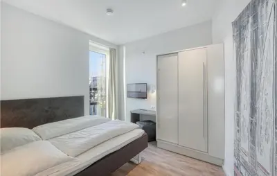 Ein Bett oder Betten in einem Zimmer der Unterkunft Passatvilla - Apartment 4