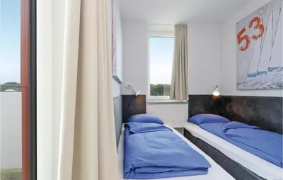 Ein Bett oder Betten in einem Zimmer der Unterkunft Passatvilla - Apartment 7