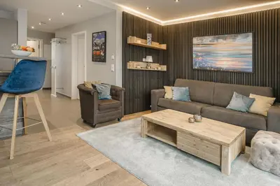 Ein Sitzbereich in der Unterkunft Beach House Penthousewohnung Düne