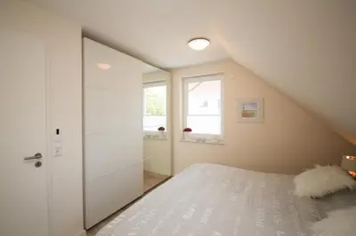 Ein Bett oder Betten in einem Zimmer der Unterkunft Ferienwohnung Min to Huus