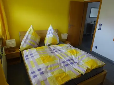 Ein Bett oder Betten in einem Zimmer der Unterkunft Haus Stadtoase