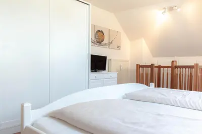 Ein Bett oder Betten in einem Zimmer der Unterkunft Ferienwohnung Ocean Drive 2