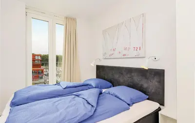Ein Bett oder Betten in einem Zimmer der Unterkunft Passatvilla - Apartment 6