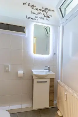 Ein Badezimmer in der Unterkunft Scharbeutz 2- Zimmer- Luxus Apartment mit eigener Sauna