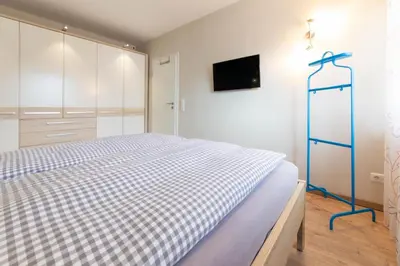 Ein Bett oder Betten in einem Zimmer der Unterkunft Ferienwohnung Beau Rivage Seaside