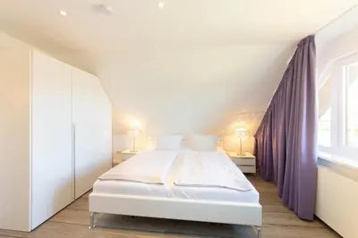 Ein Bett oder Betten in einem Zimmer der Unterkunft Ferienwohnung Zweimaster