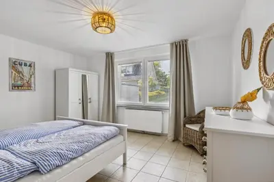 Ein Bett oder Betten in einem Zimmer der Unterkunft Strand Quartier