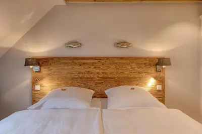 Ein Bett oder Betten in einem Zimmer der Unterkunft Herzbergs.Ferienwohnungen Meerfühlen