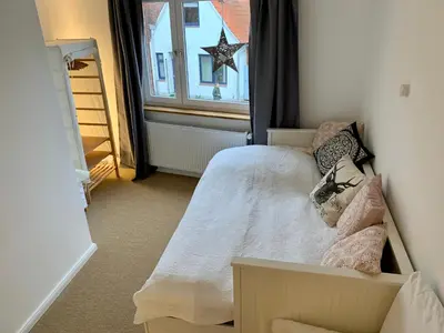 Ein Bett oder Betten in einem Zimmer der Unterkunft Fischerhaus von 1680 Travemünde