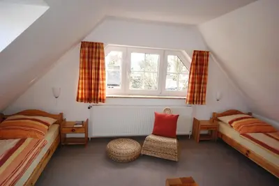 Ein Bett oder Betten in einem Zimmer der Unterkunft Gorch-Fock-Park