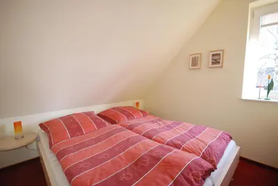 Ein Bett oder Betten in einem Zimmer der Unterkunft Gorch-Fock-Park