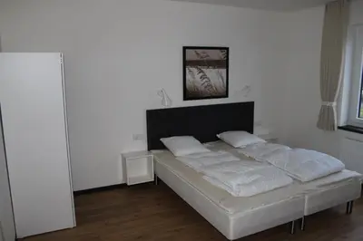 Ein Bett oder Betten in einem Zimmer der Unterkunft Dünenhaus Wohnung 7