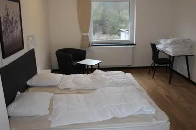 Ein Bett oder Betten in einem Zimmer der Unterkunft Dünenhaus Wohnung 9