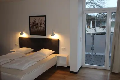 Ein Bett oder Betten in einem Zimmer der Unterkunft Dünenhaus Wohnung 6