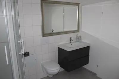Ein Badezimmer in der Unterkunft Dünenhaus Wohnung 6