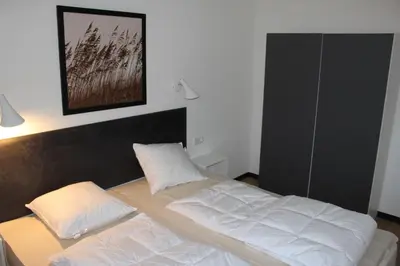 Ein Bett oder Betten in einem Zimmer der Unterkunft Dünenhaus Wohnung 6