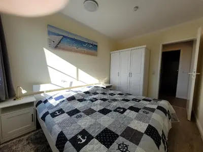 Ein Bett oder Betten in einem Zimmer der Unterkunft Am Pool und Strand 11