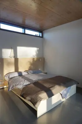 Ein Bett oder Betten in einem Zimmer der Unterkunft Design Ferienhaus nienrausch mit 2 Apartments