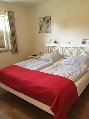 Ein Bett oder Betten in einem Zimmer der Unterkunft Flair Landhotel Strengliner Mühle