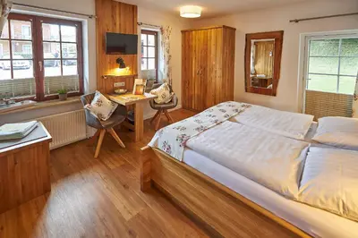 Ein Bett oder Betten in einem Zimmer der Unterkunft Flair Landhotel Strengliner Mühle