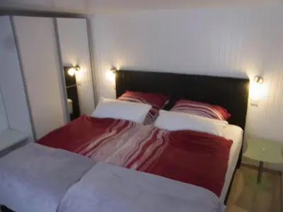 Ein Bett oder Betten in einem Zimmer der Unterkunft Waldhütte am See