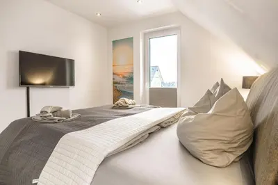 Ein Bett oder Betten in einem Zimmer der Unterkunft Baltic House Penthousewohnung Seestern