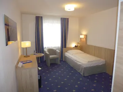 Ein Bett oder Betten in einem Zimmer der Unterkunft Hotel Deutscher Kaiser