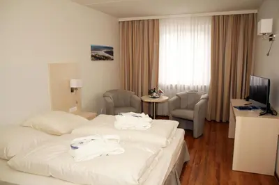 Ein Bett oder Betten in einem Zimmer der Unterkunft Hotel Deutscher Kaiser